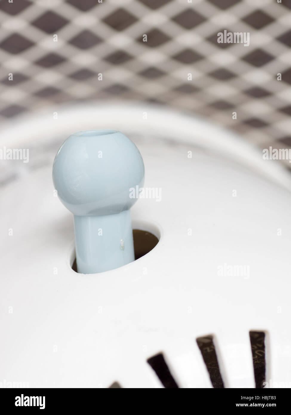 A blue knob switch of Japanese electric fan to activate the oscillating function Stock Photo Alamy