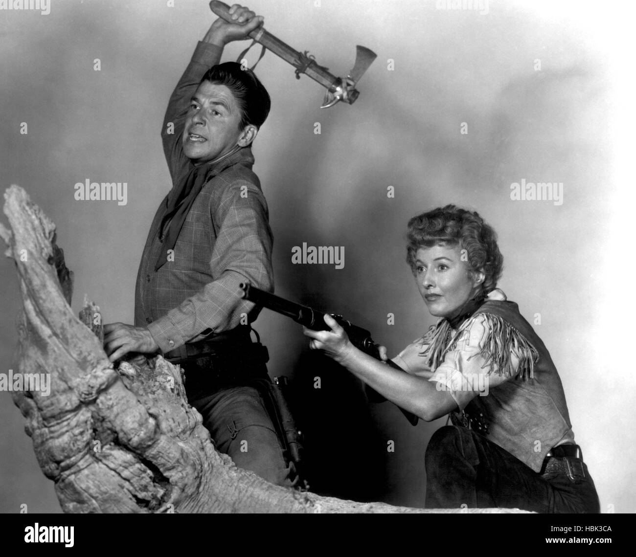 CATTLE QUEEN OF MONTANA, Ronald Reagan, Barbara Stanwyck, 1954 Stock