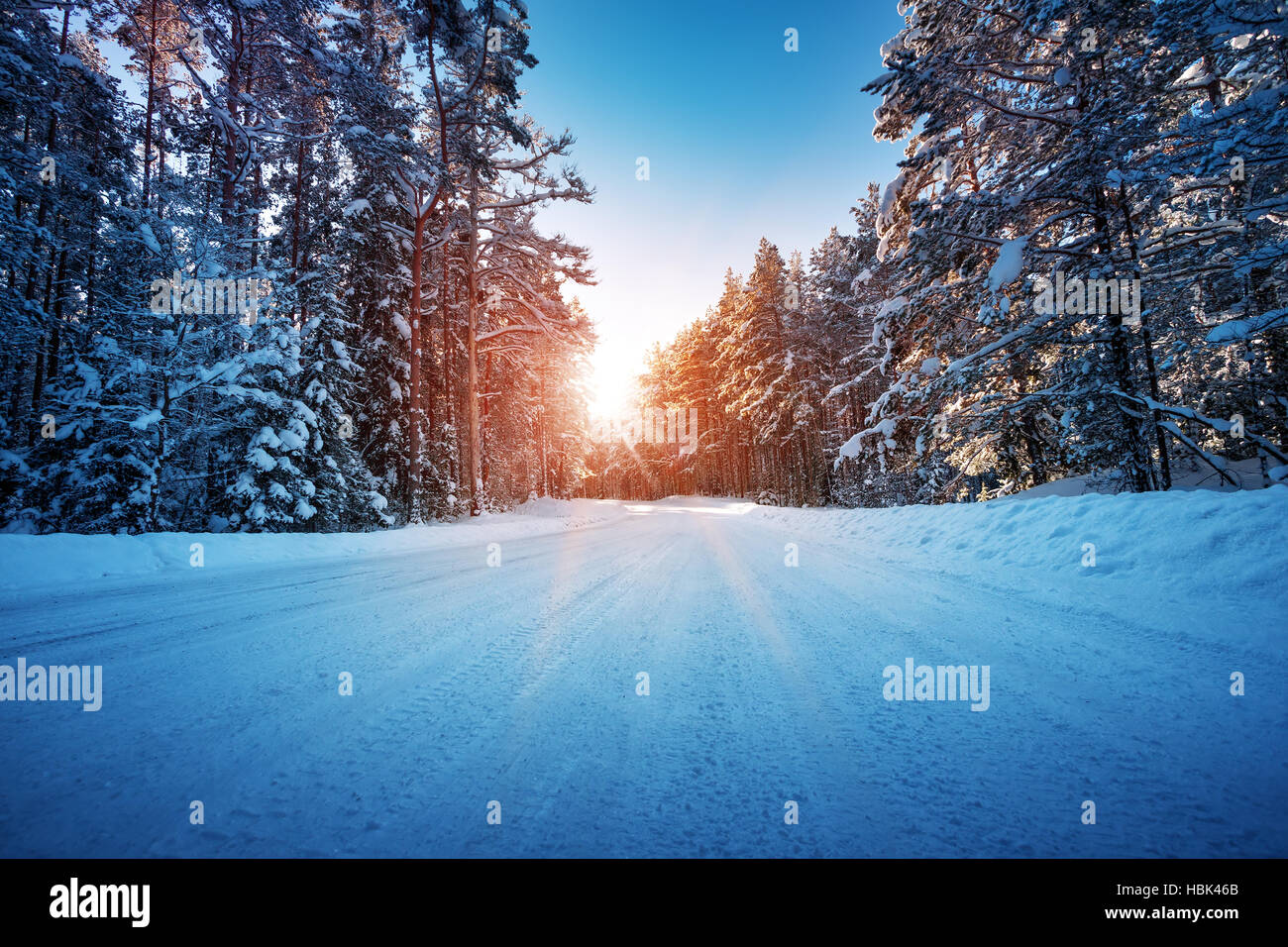 Asphalt road in snowy winter on beautiful sunny day Stock Photo - Alamy