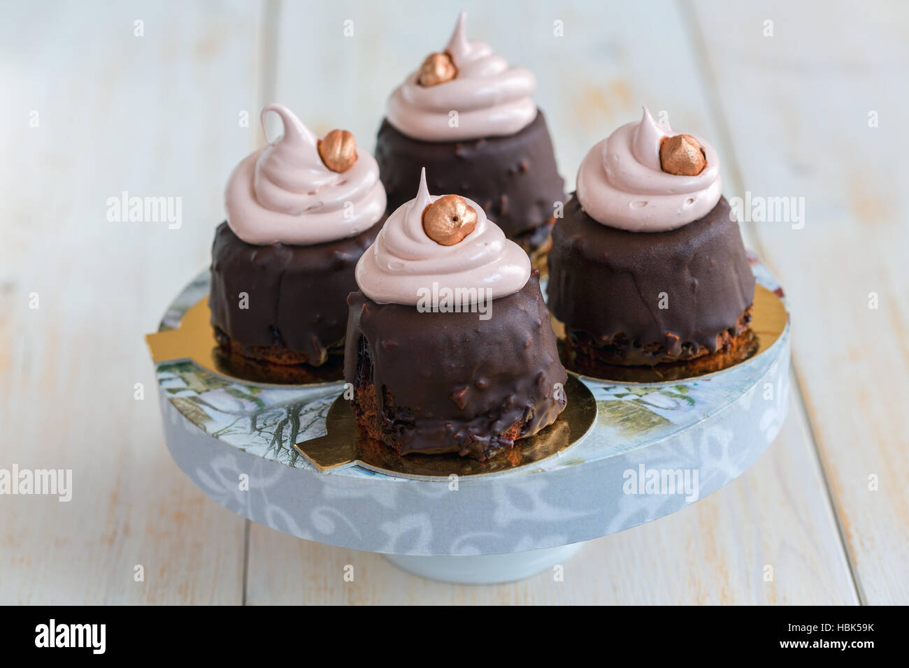 Chocolate cupcakes with Swiss meringue. Stock Photo