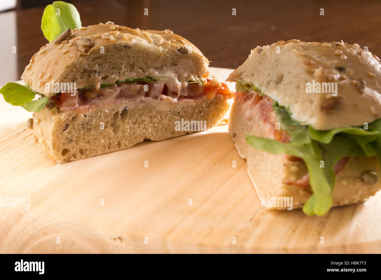 Sandwich cut in half with fresh smoked meat Stock Photo Alamy
