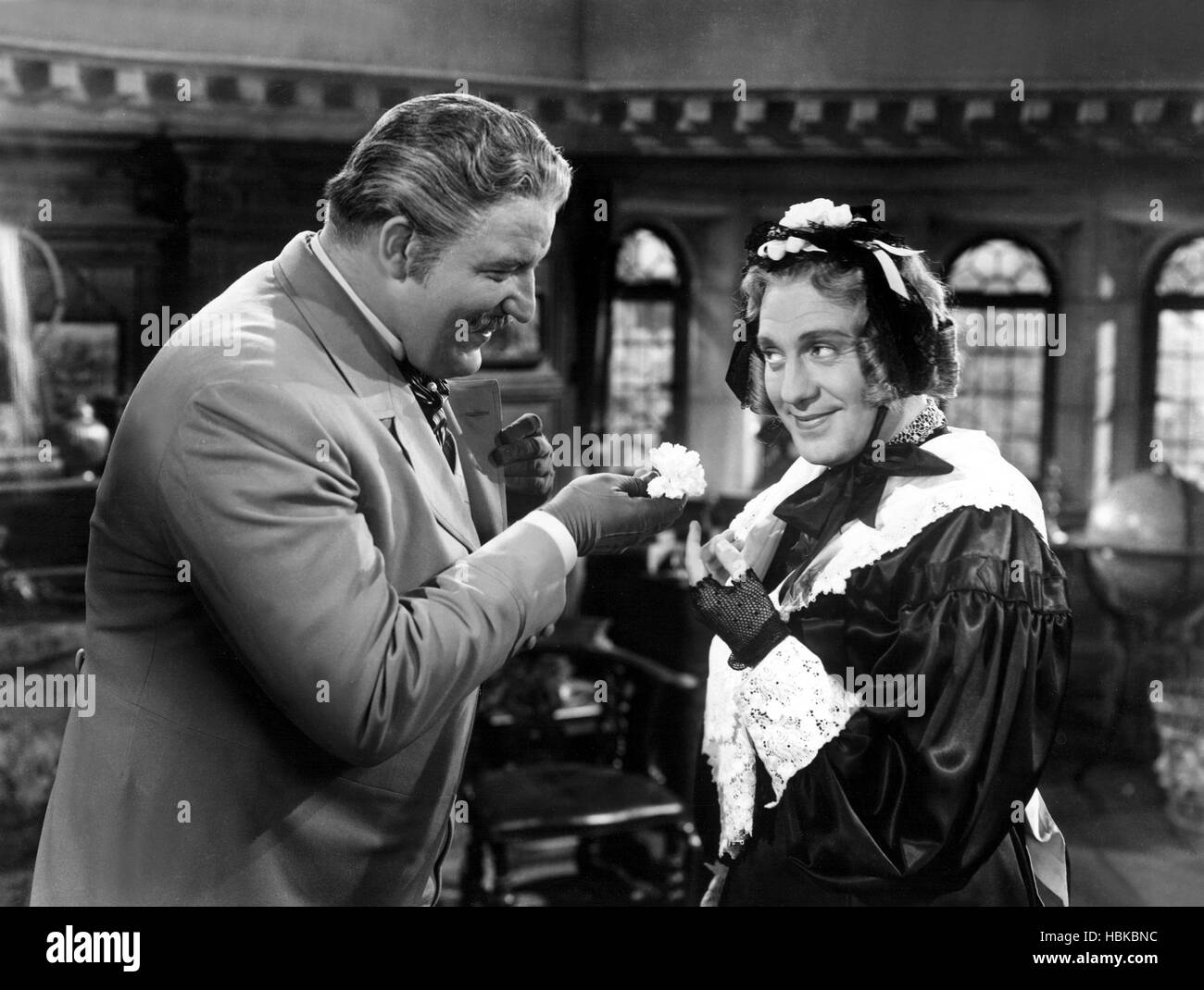 CHARLEY'S AUNT, Laird Cregar, Jack Benny, 1941, offering a flower Stock Photo