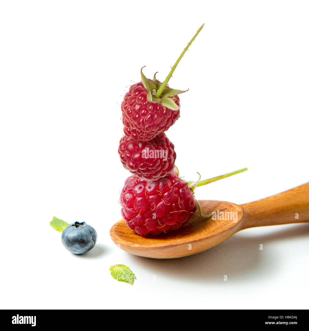 Raspberry in wooden spoon Stock Photo - Alamy