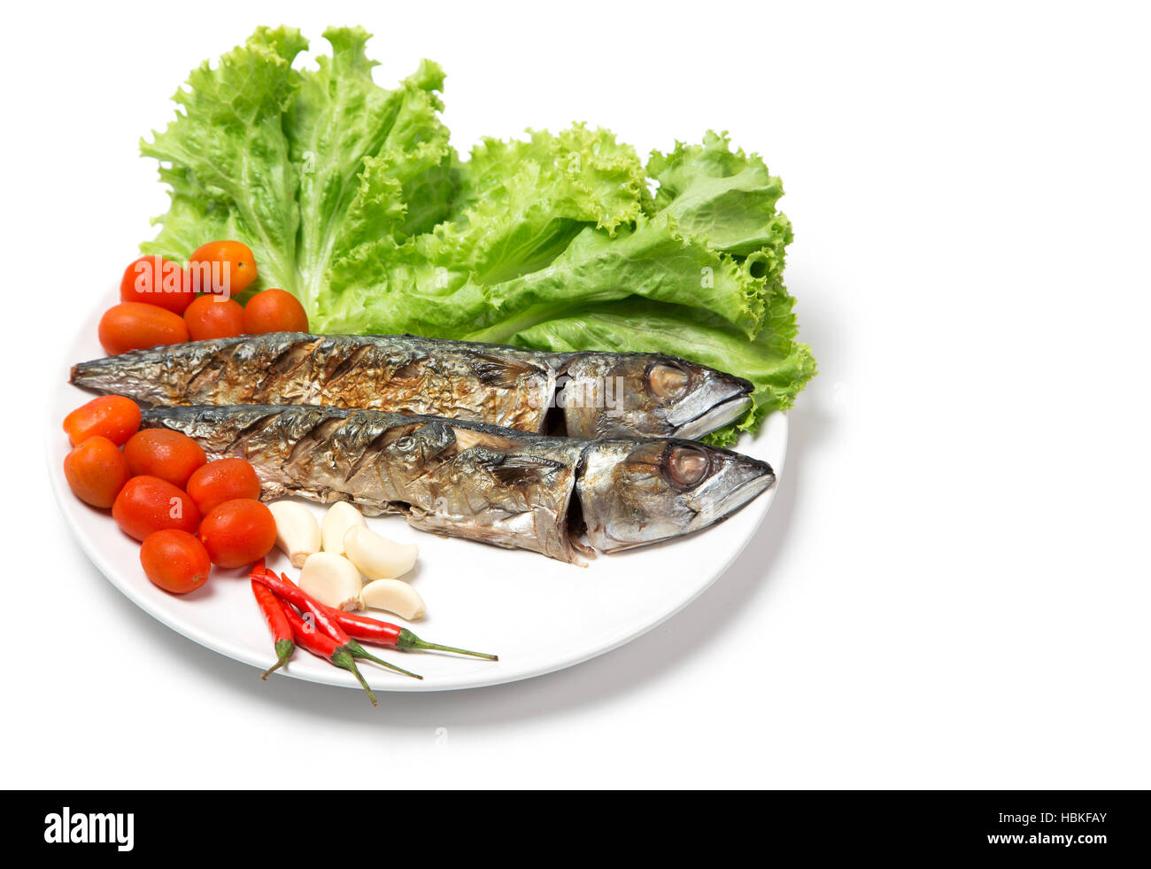 grill fish seafood on dish serve with vegetable on white background