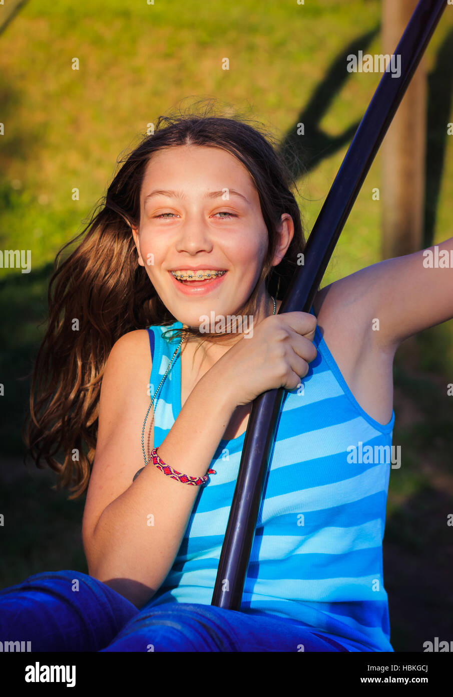Teenager on a swing Stock Photo