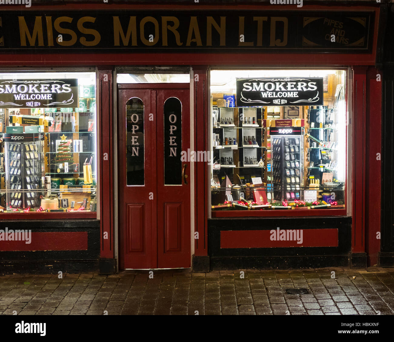 Smokers Miss Moran's tobacco shop at night, Belfast, Northern