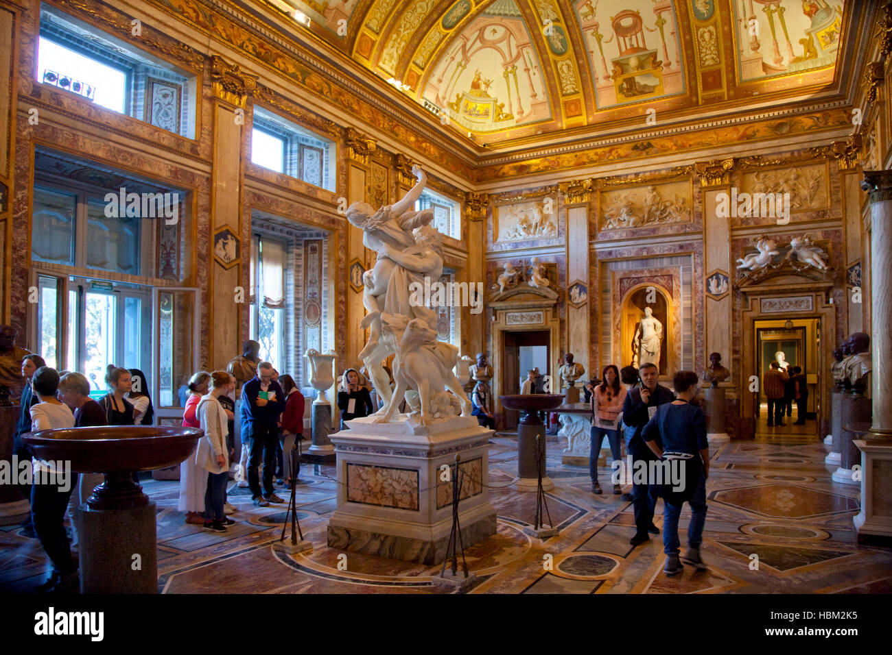 Rome, Villa Borghese, museum and gallery, Bernini sculpture in gallery with tourists Stock Photo