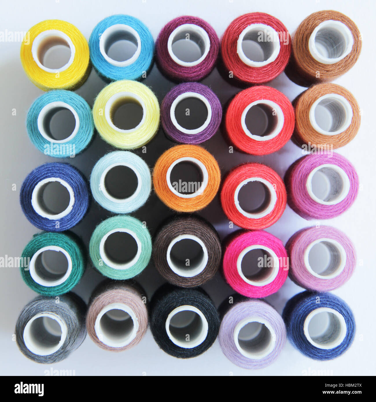 Sewing colored threads Stock Photo - Alamy
