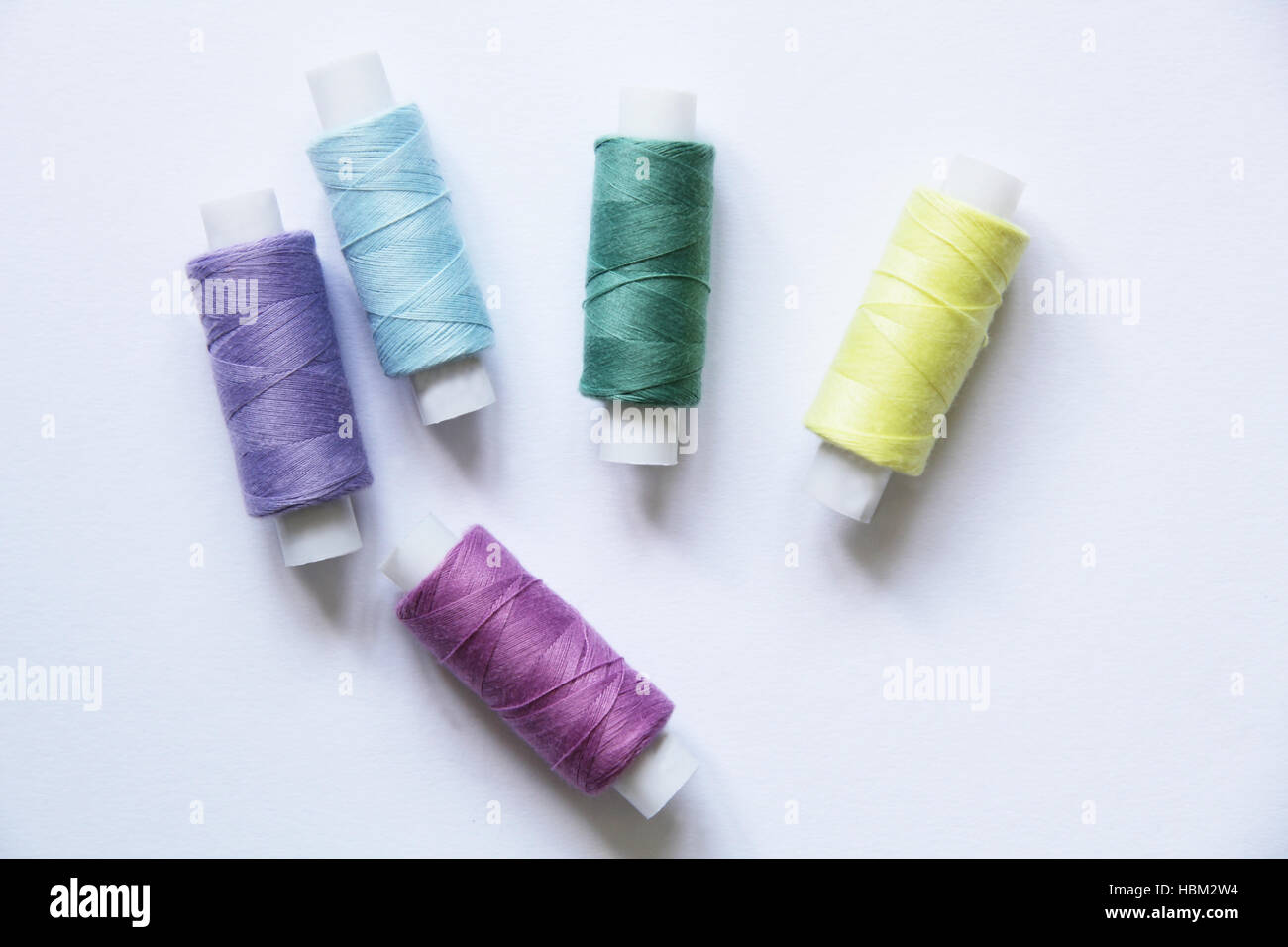 Sewing colored threads Stock Photo - Alamy