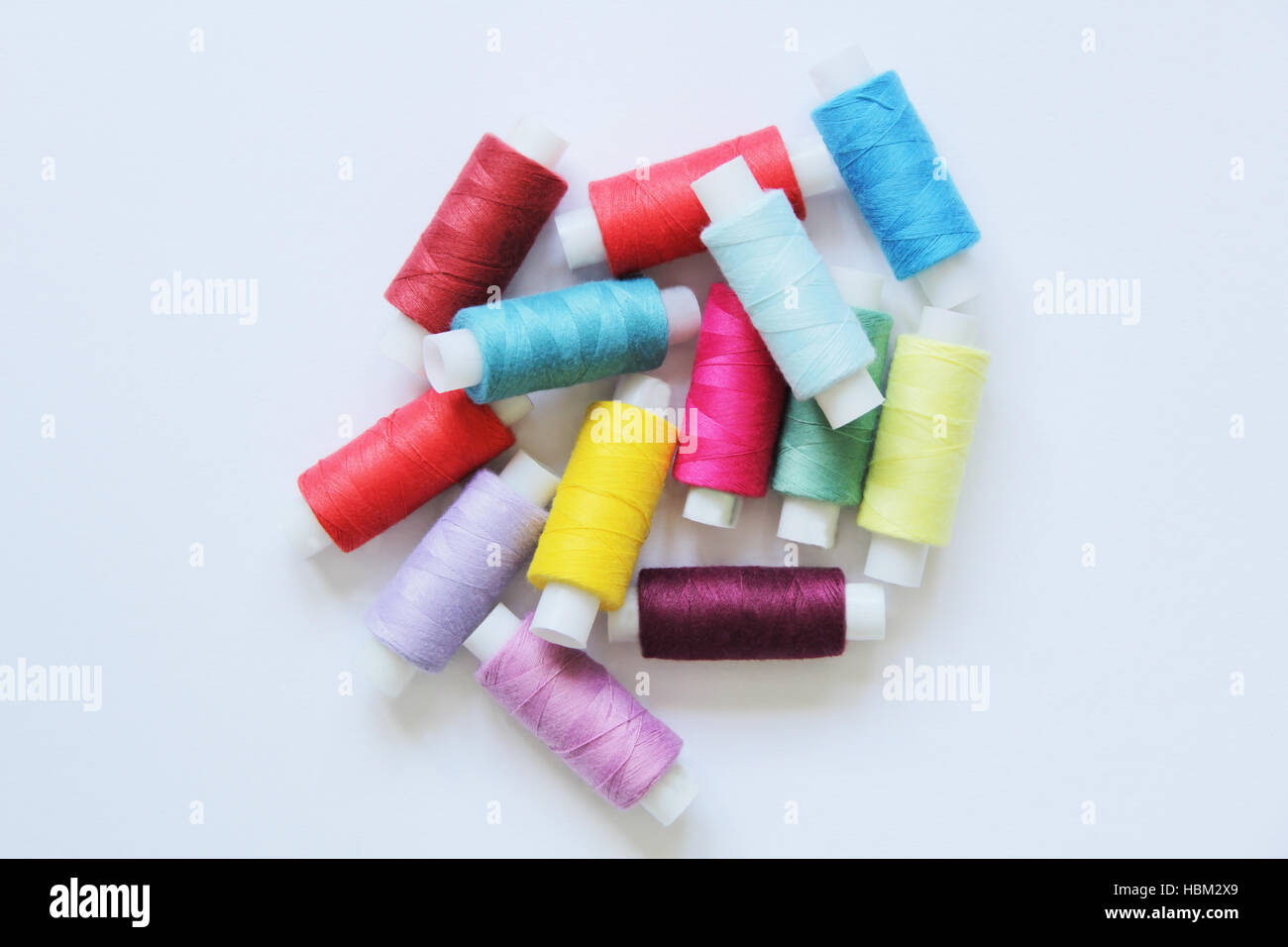 Sewing colored threads Stock Photo - Alamy