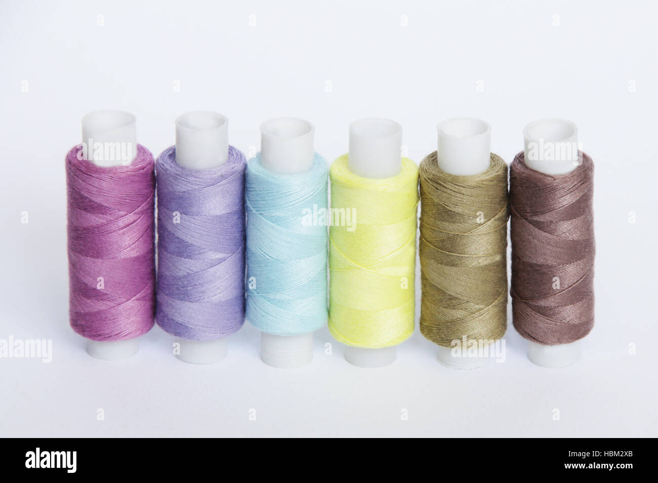 Sewing colored threads Stock Photo - Alamy