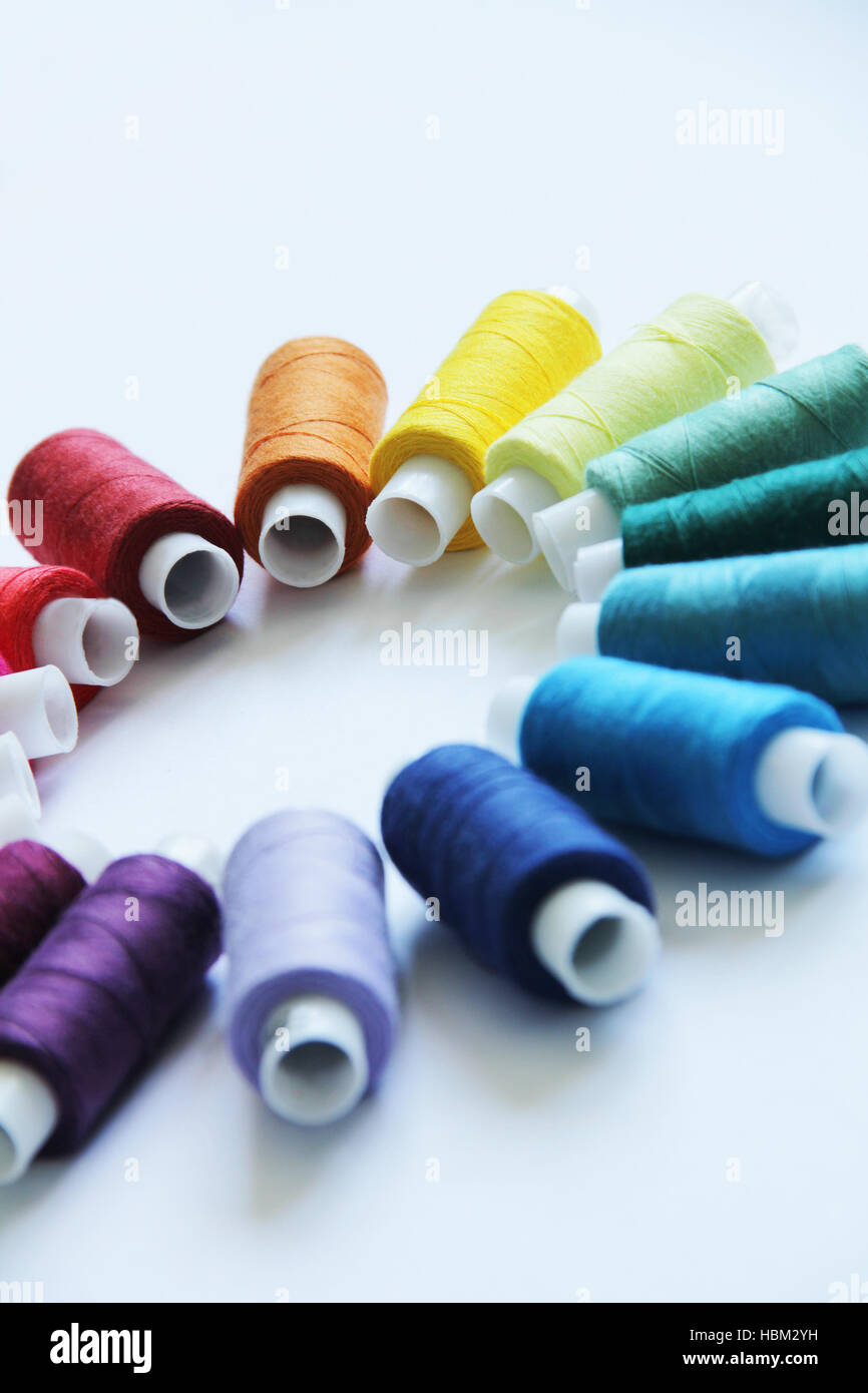 Sewing colored threads Stock Photo - Alamy