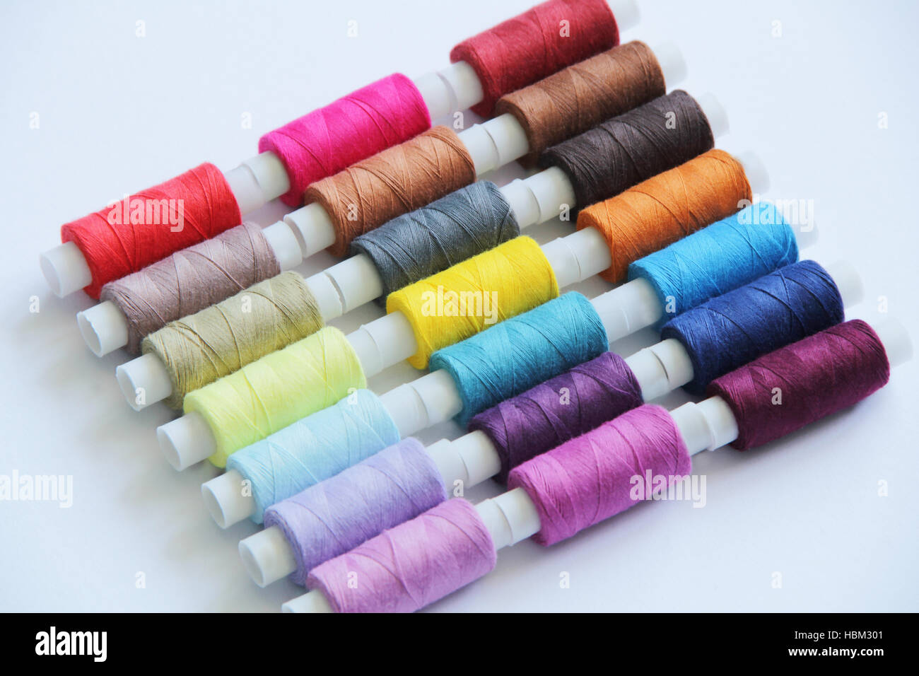 Sewing colored threads Stock Photo - Alamy