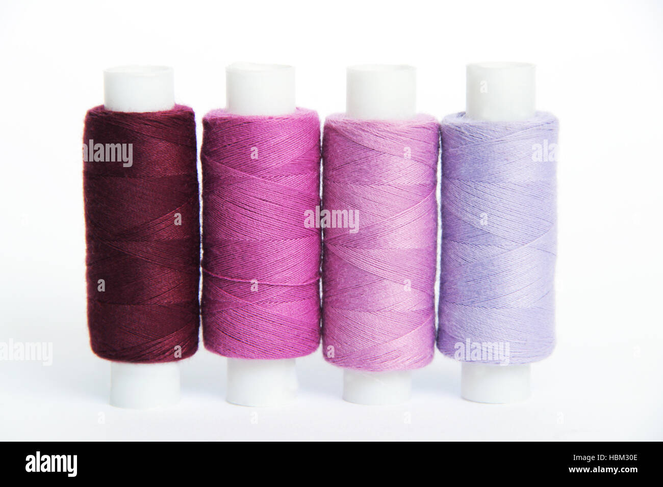 Sewing colored threads Stock Photo - Alamy