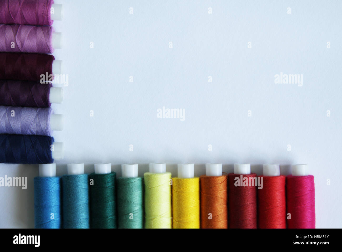 Sewing colored threads Stock Photo - Alamy