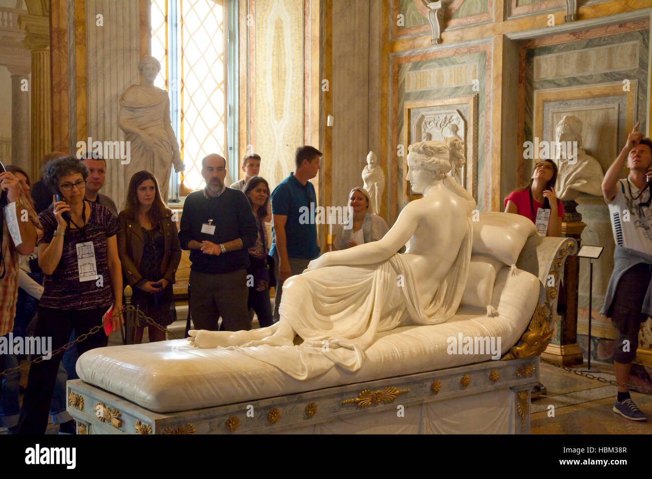 Rome, Villa Borghese, museum and gallery, guide showing tourists Antonio Canova's Venus, 1805, posed by Pauline Bonaparte Stock Photo