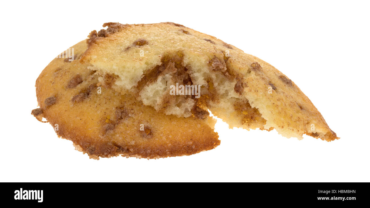 An apple spice muffin top that has been broken in half isolated on a white background. Stock Photo