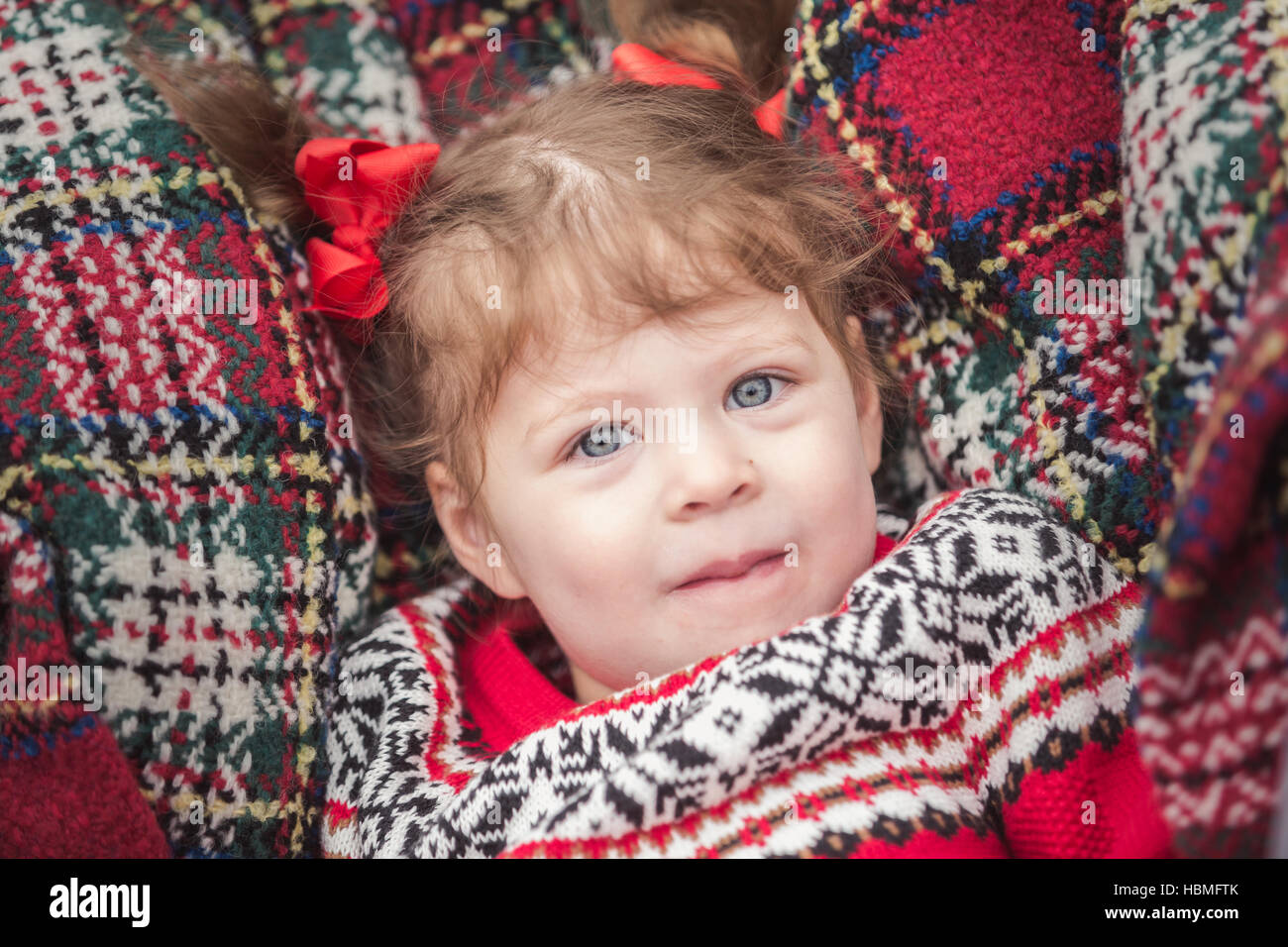 Little girl in red dress on the Christmas tree farm Stock Photo - Alamy