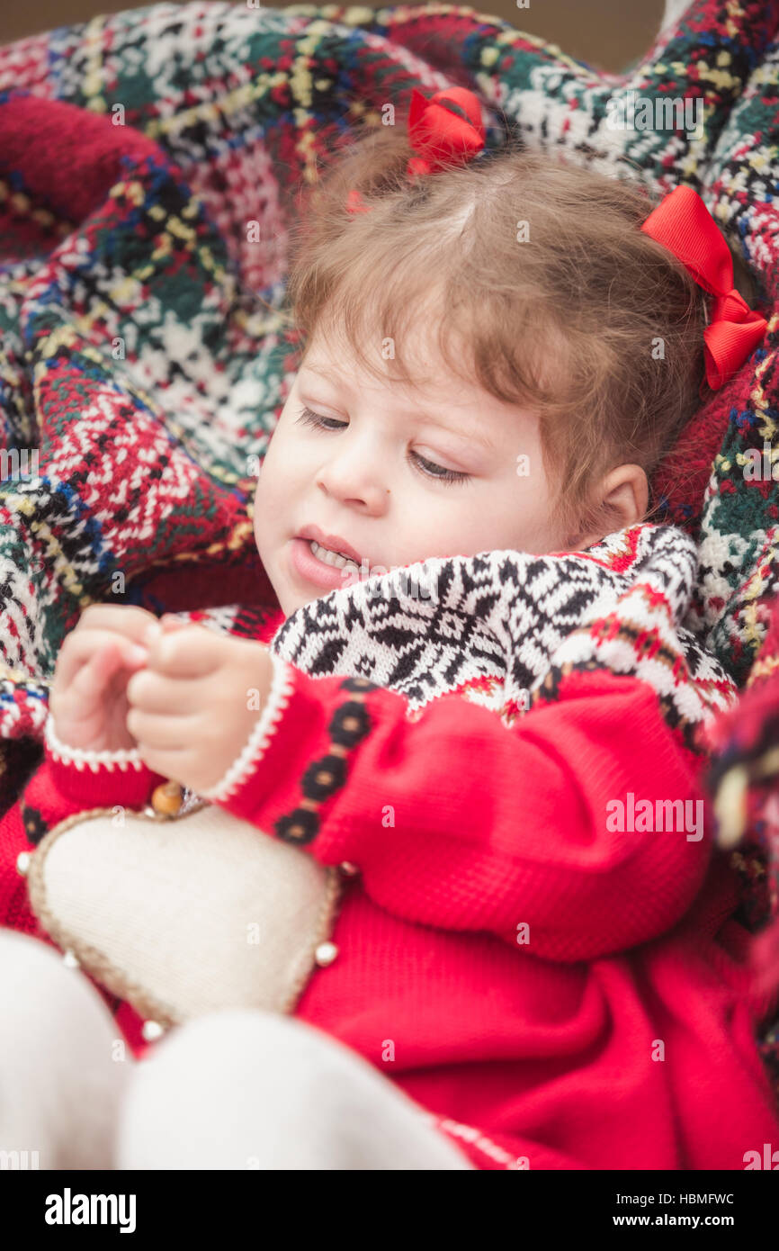 Little girl in red dress on the Christmas tree farm Stock Photo - Alamy