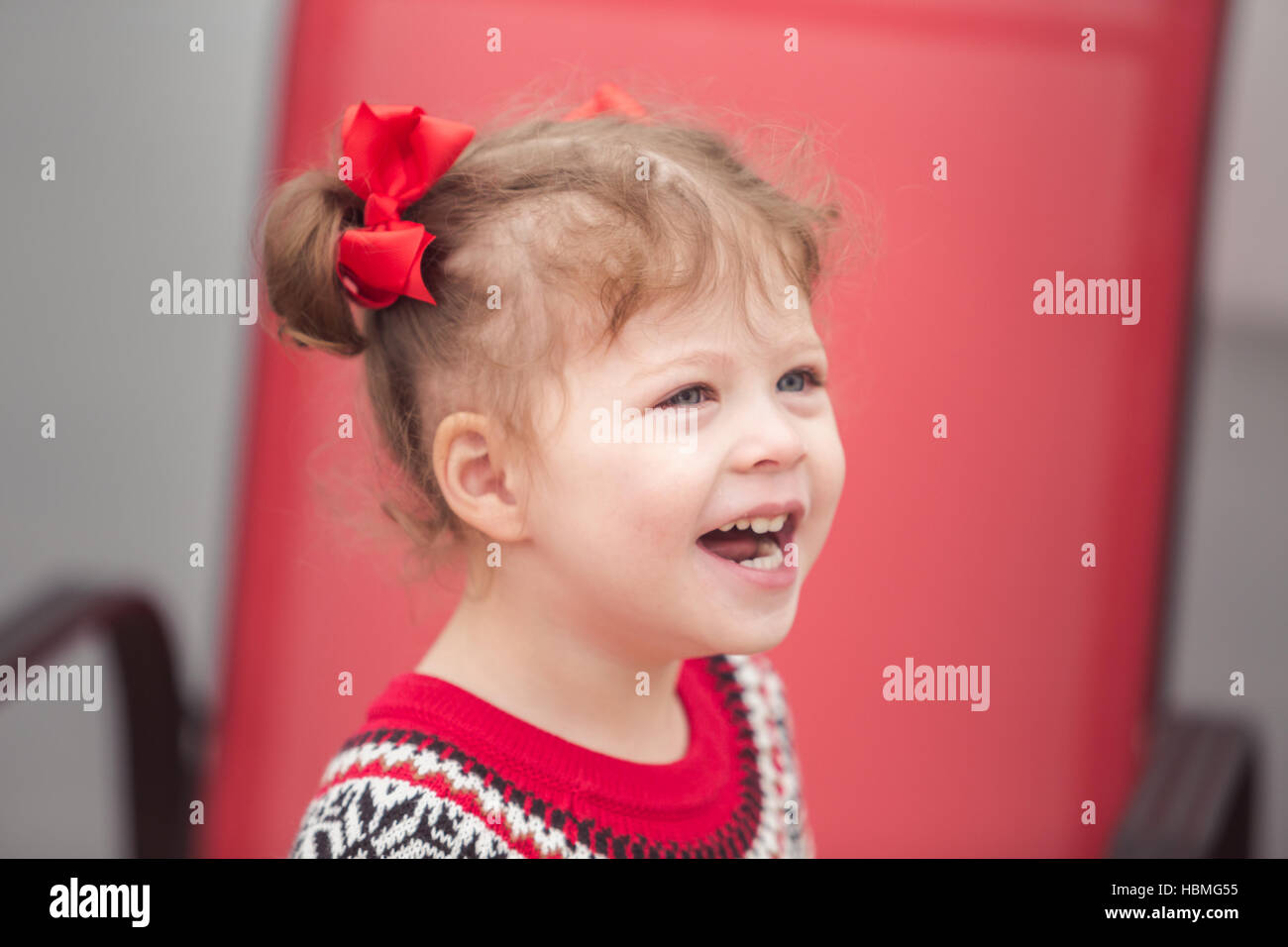 Little girl in red dress on the Christmas tree farm Stock Photo - Alamy