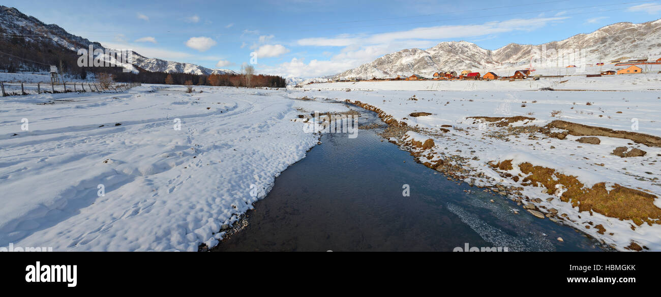 Mountain village winter brook Stock Photo