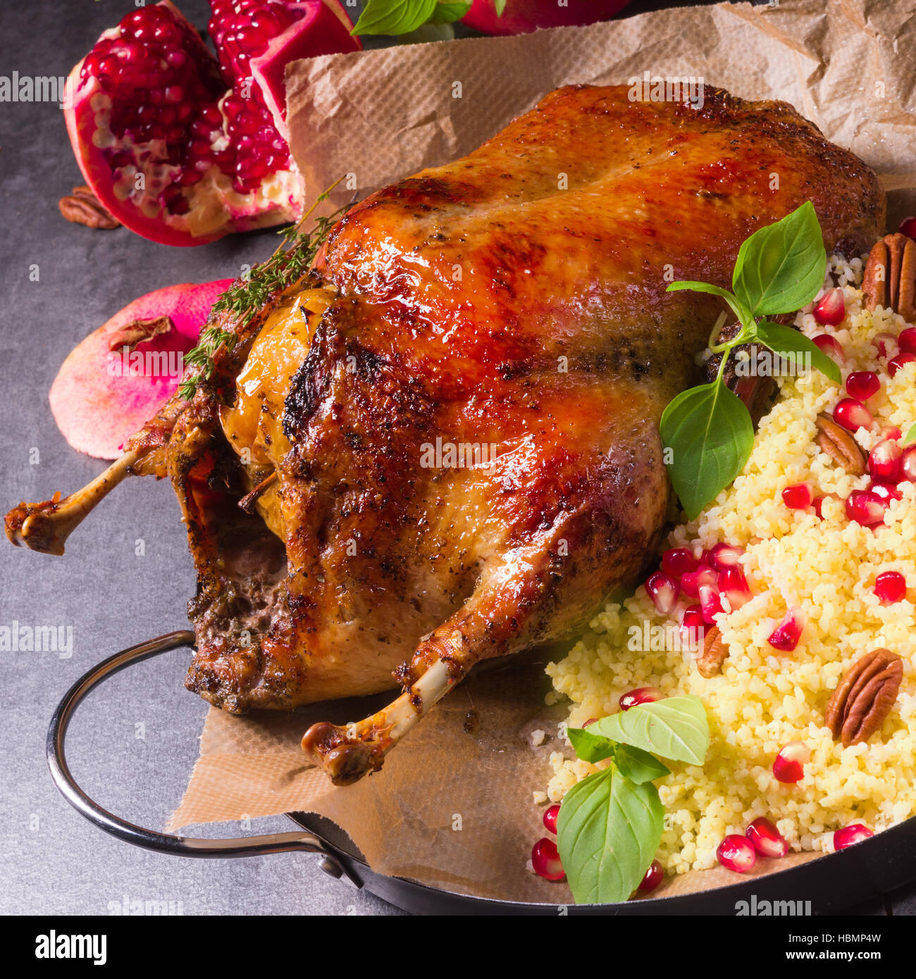 Duck with millet and pomegranate Stock Photo Alamy