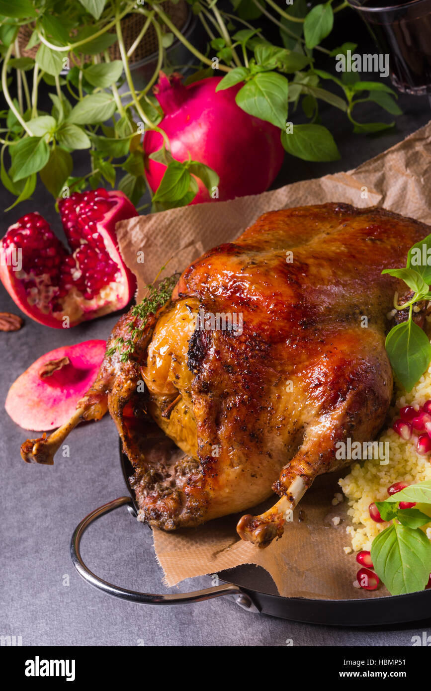 Duck with millet and pomegranate Stock Photo Alamy