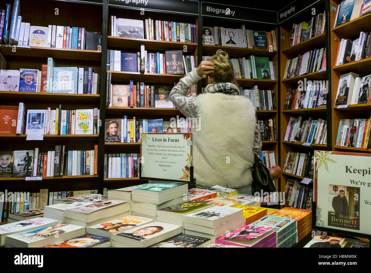 A customer browsing in a Waterstones Bookshop. Stock Photo