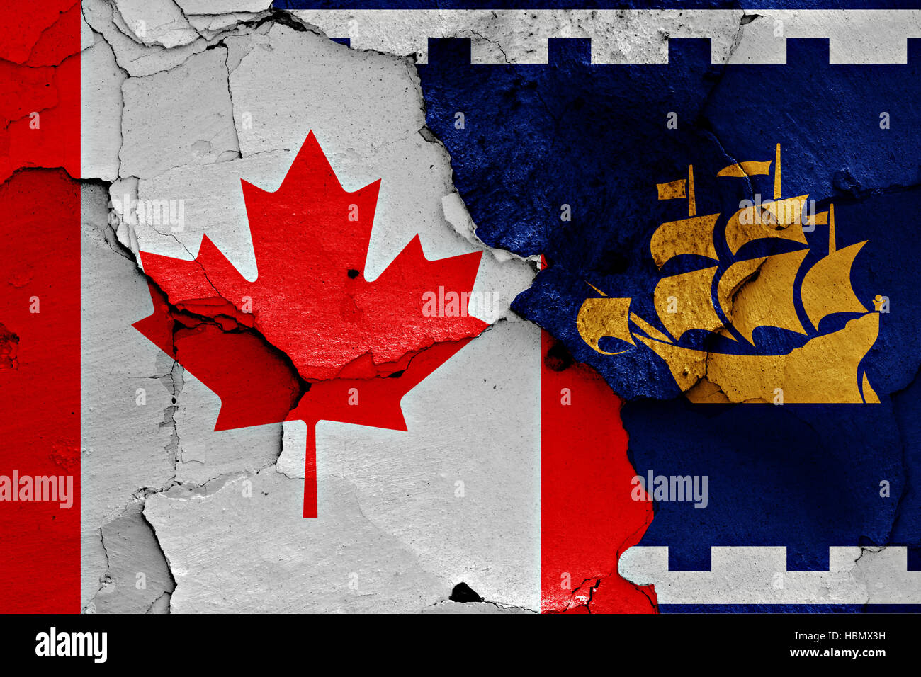 flags of Canada and Quebec City painted on cracked wall Stock Photo
