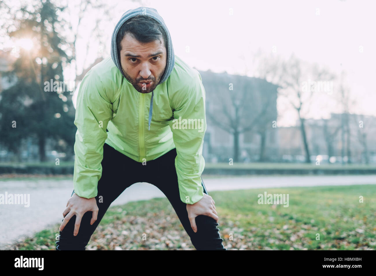 Man working out in the city park in cold weather Stock Photo