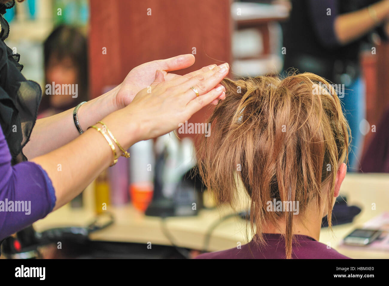 Hairdresser applying hair gel Stock Photo Alamy