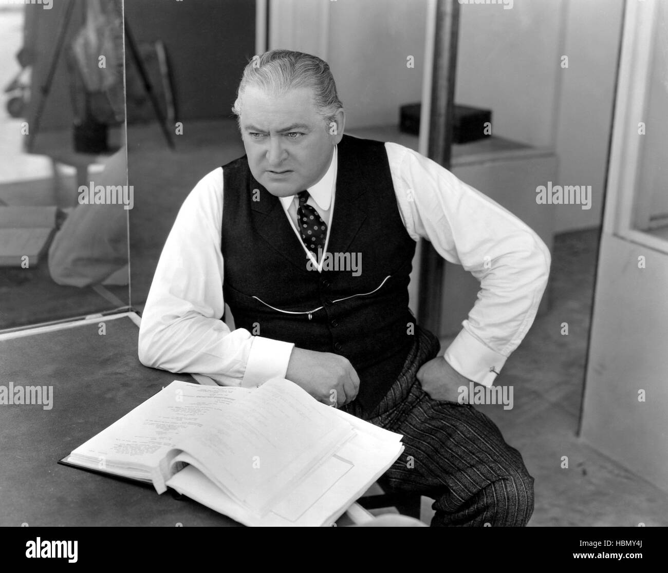 Studing Script EASY LIVING, Edward Arnold studying script, on-set, 1937 Stock Photo ...