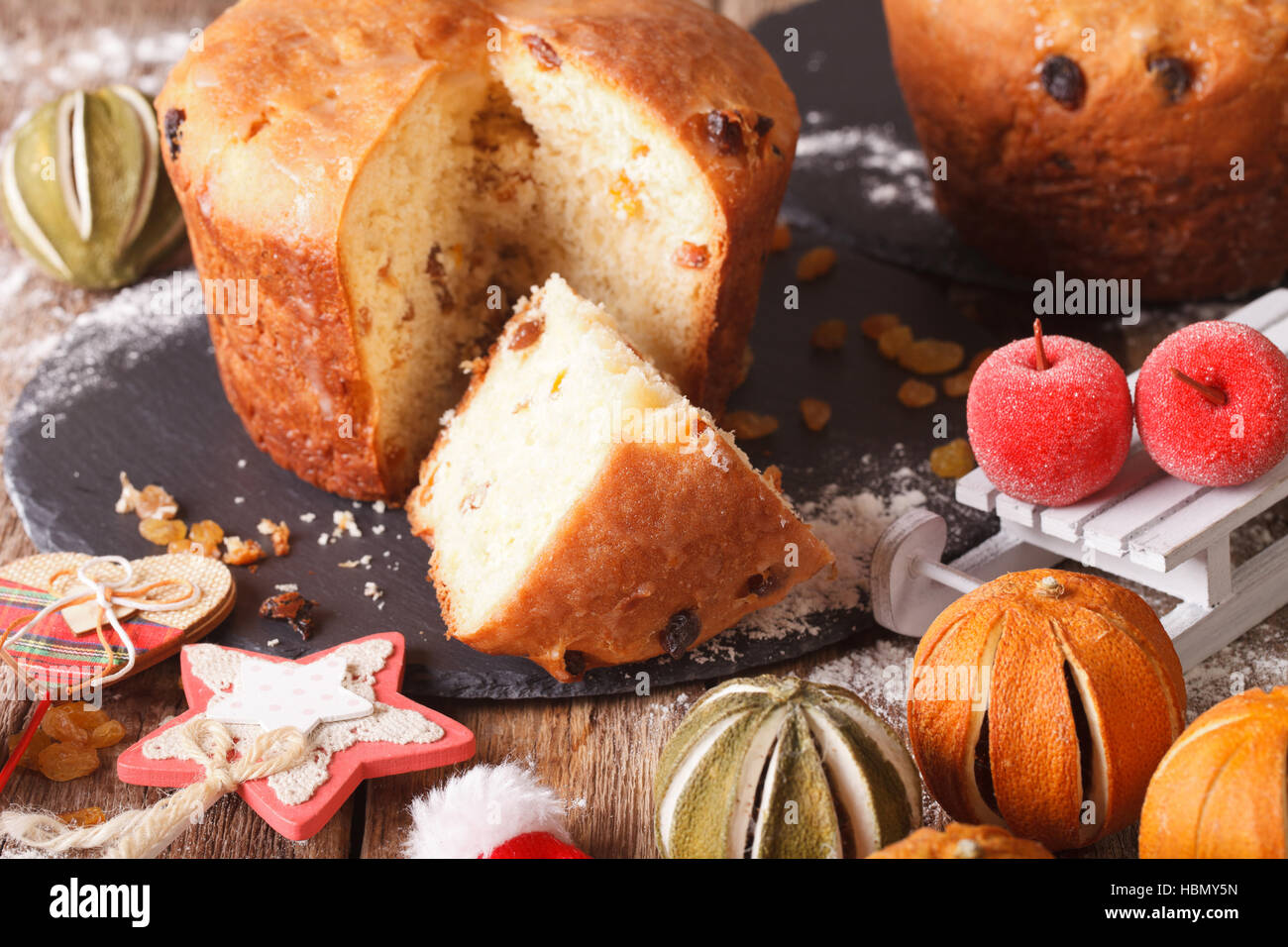 italian christmas cake with raisins and festive decoration close up on the table horizontal - Italian Christmas Table Decorations italian christmas cake with raisins and festive decoration close up on the table horizontal - Italian Christmas Table Decorations