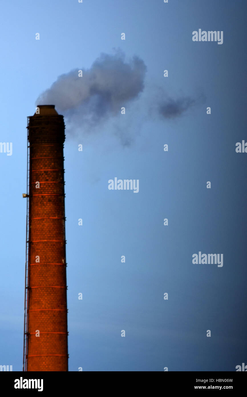 Smoking industrial chimney Stock Photo