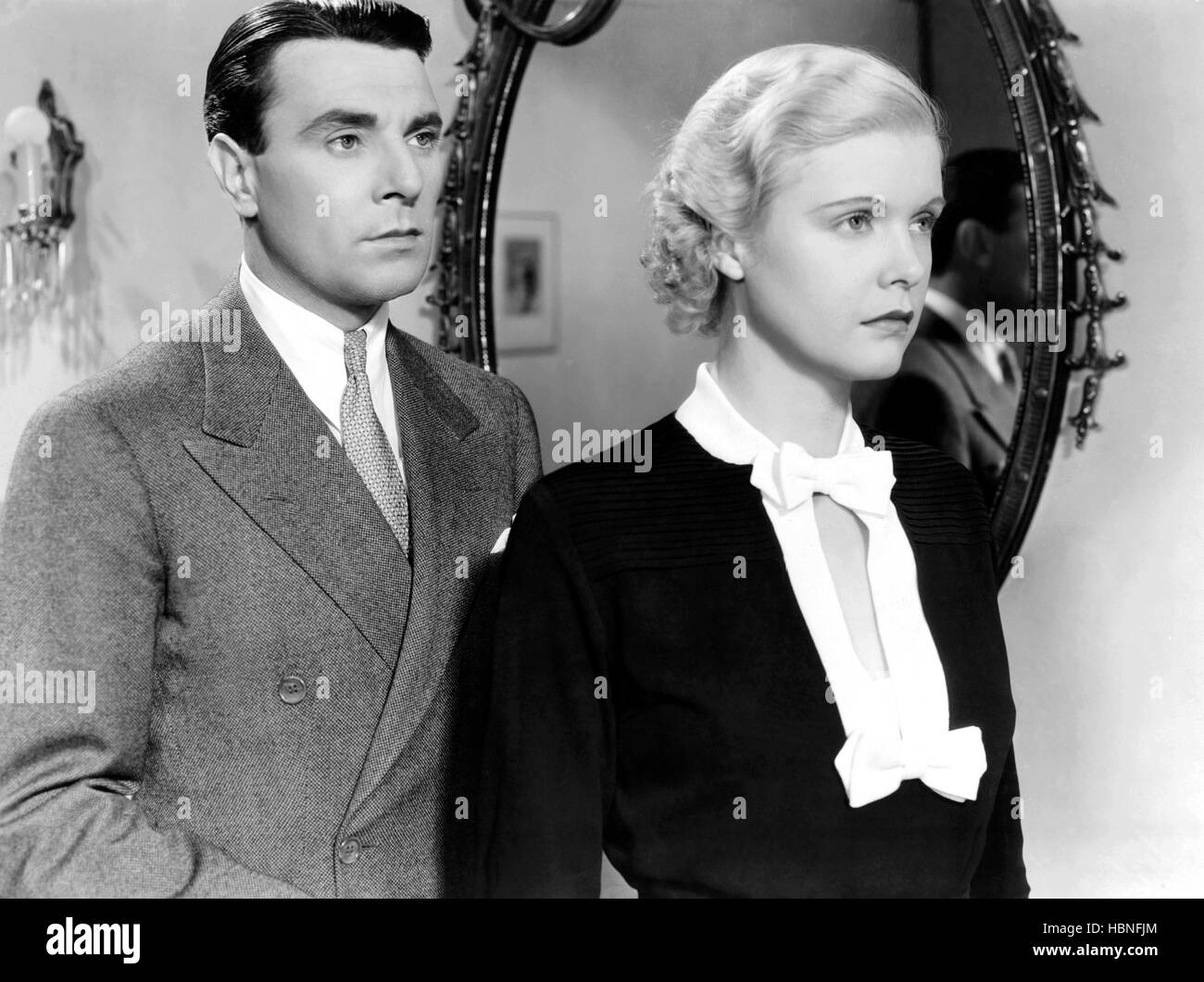 DESIRABLE, from left, George Brent, Jean Muir, 1934 Stock Photo - Alamy