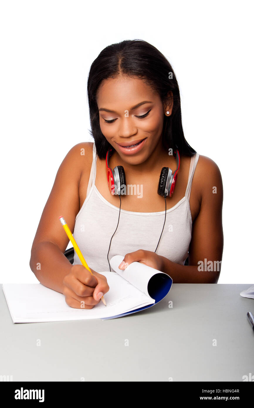 Happy teenage student doing homework Stock Photo