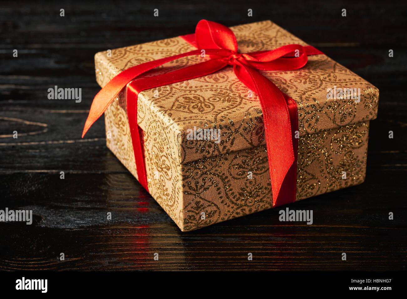 Gift box with red ribbon Stock Photo