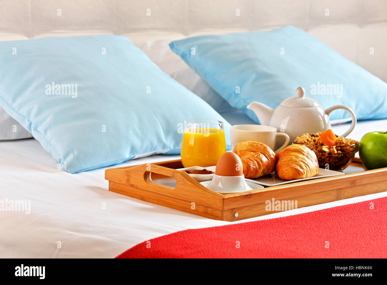 Breakfast on tray in bed in hotel room Stock Photo Alamy