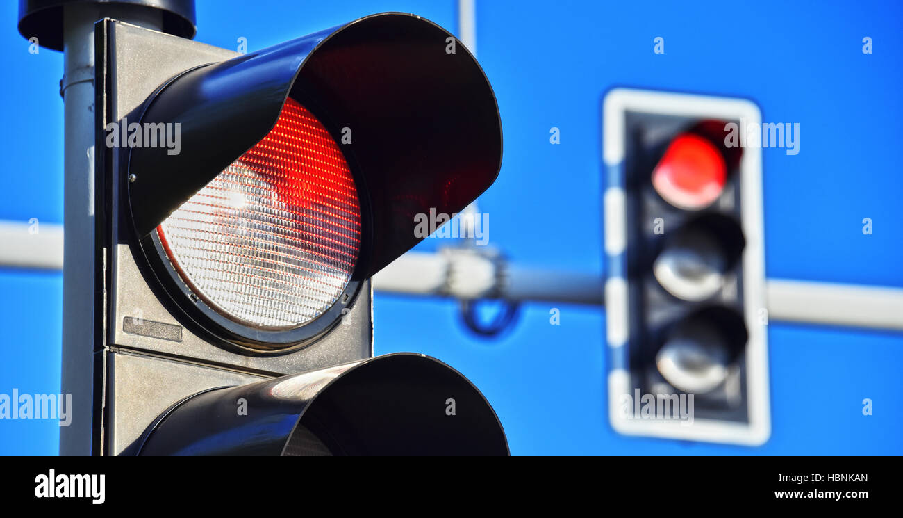 Traffic lights over blue sky. Red light Stock Photo