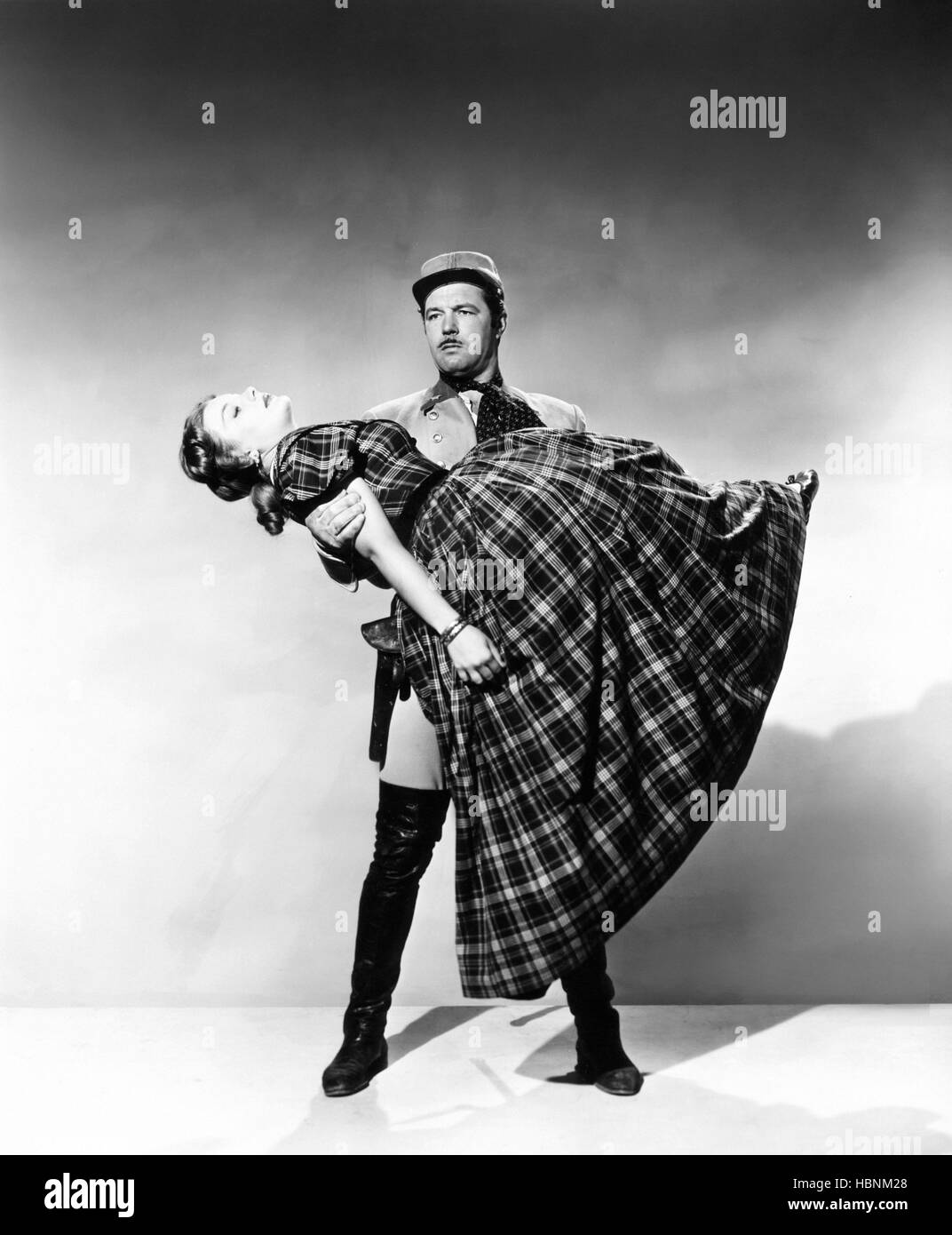DRUMS IN THE DEEP SOUTH, James Craig, holding Barbara Payton, 1951