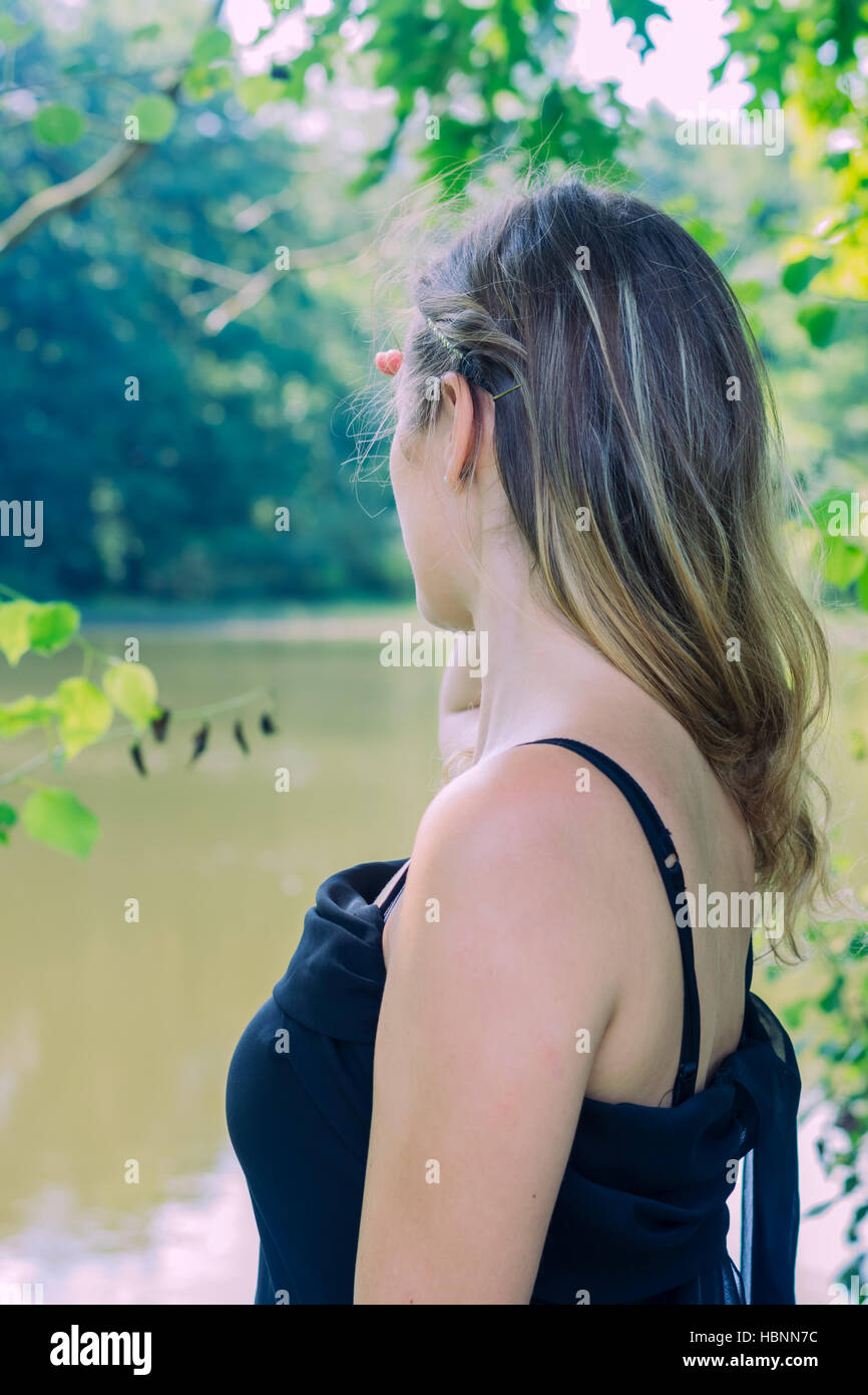 woman with black dress on the lake Stock Photo