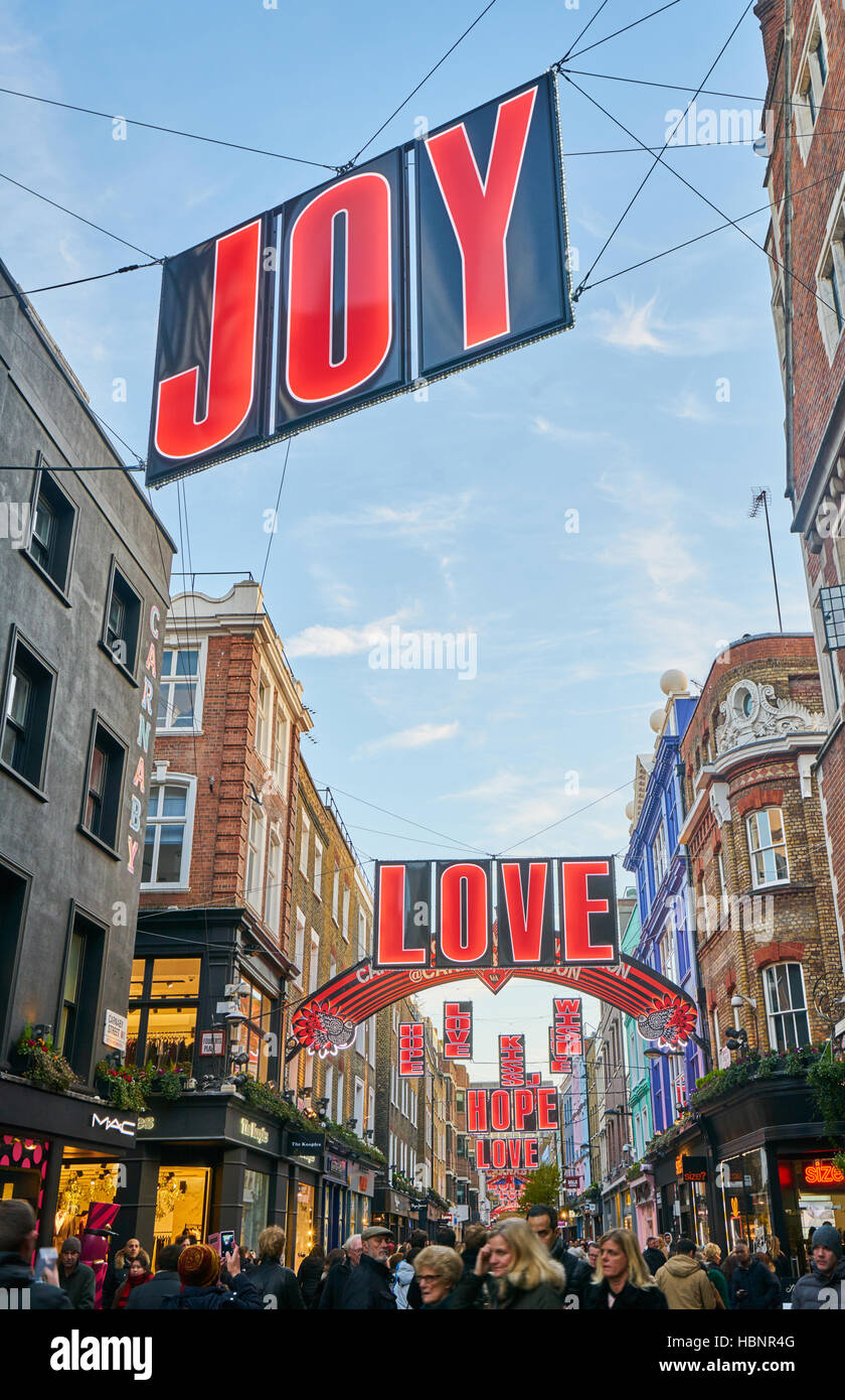 Carnaby Street, London Christmas decorations.   Joy.  Love. Stock Photo