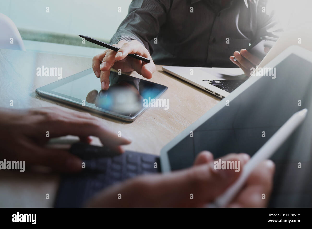 Business team meeting present. Photo professional investor working with new startup project. Finance managers meeting.Digital tablet laptop computer d Stock Photo