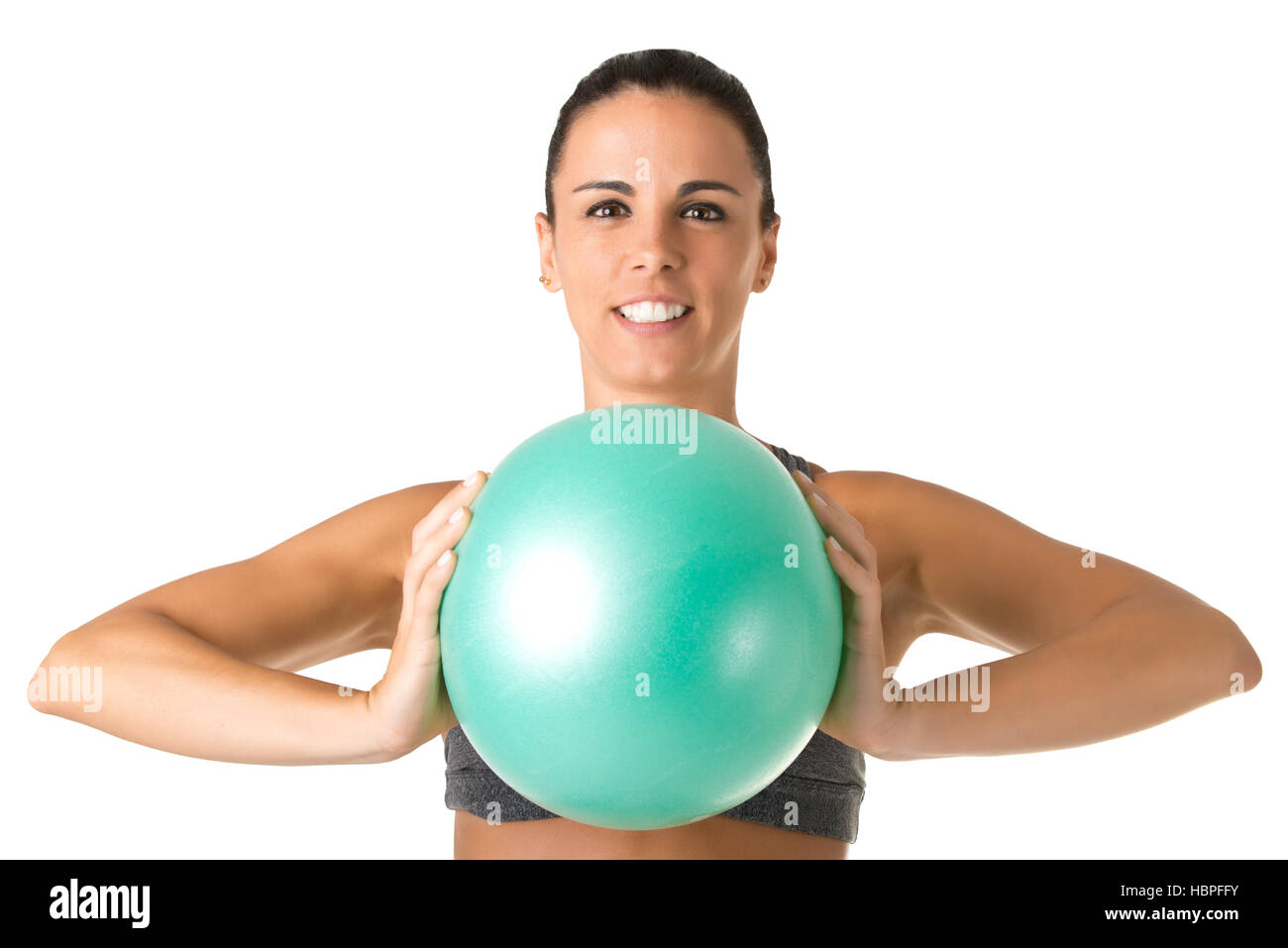 Fit Woman Standing Holding a Pilates Ball Stock Photo - Alamy