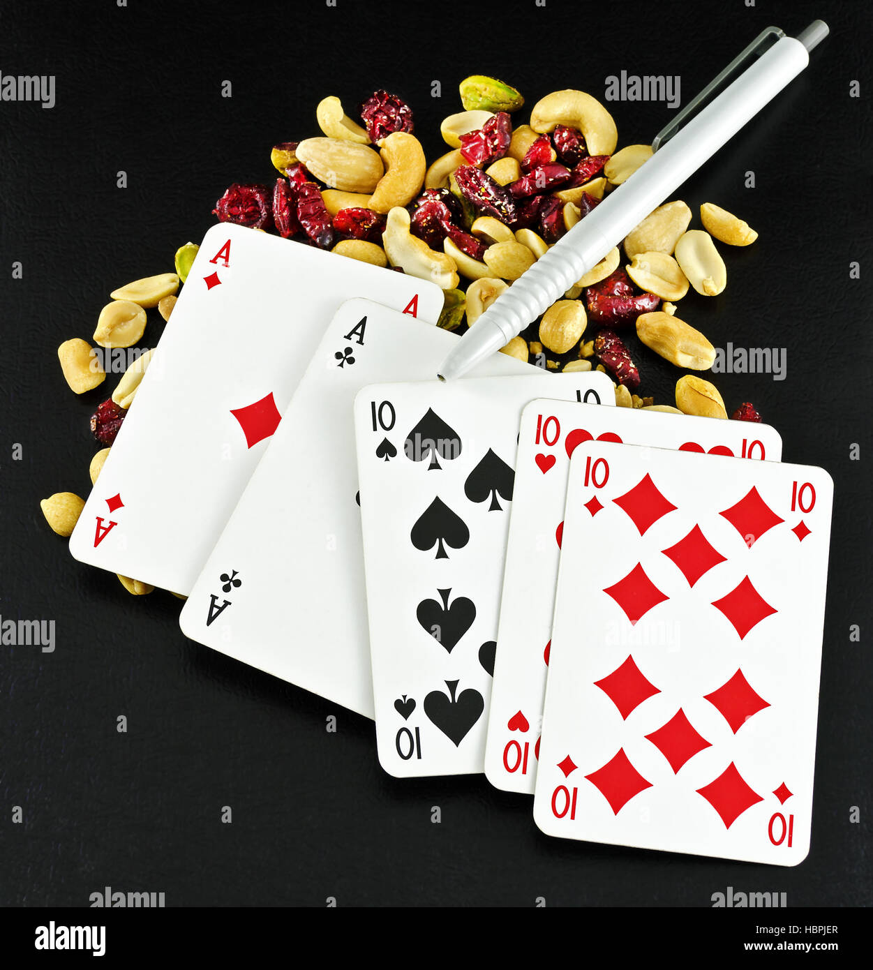 poker hand Fullhouse and student feed Stock Photo
