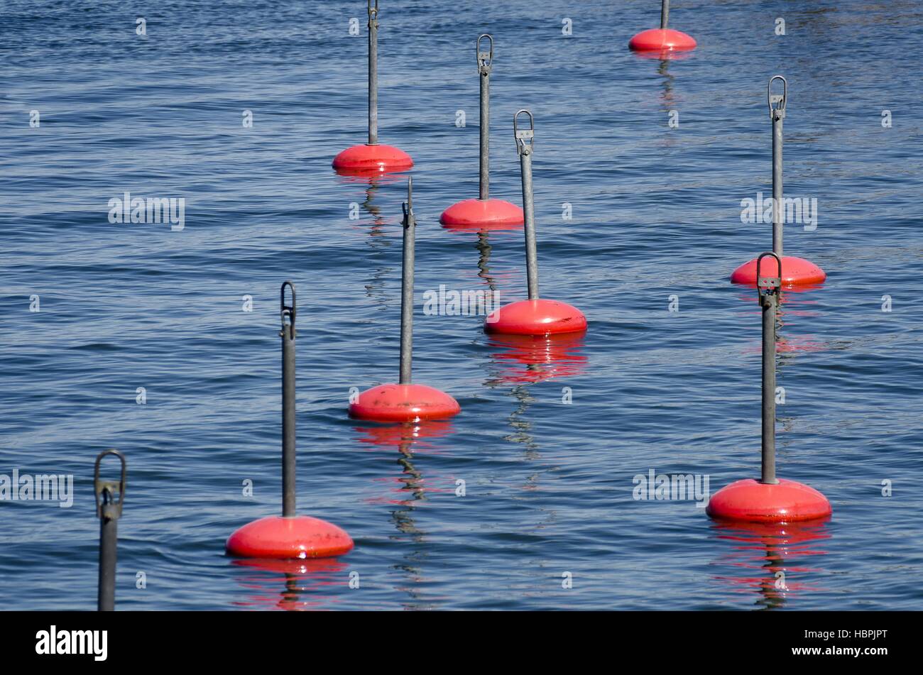 boat mooring with red berthing buoys Stock Photo