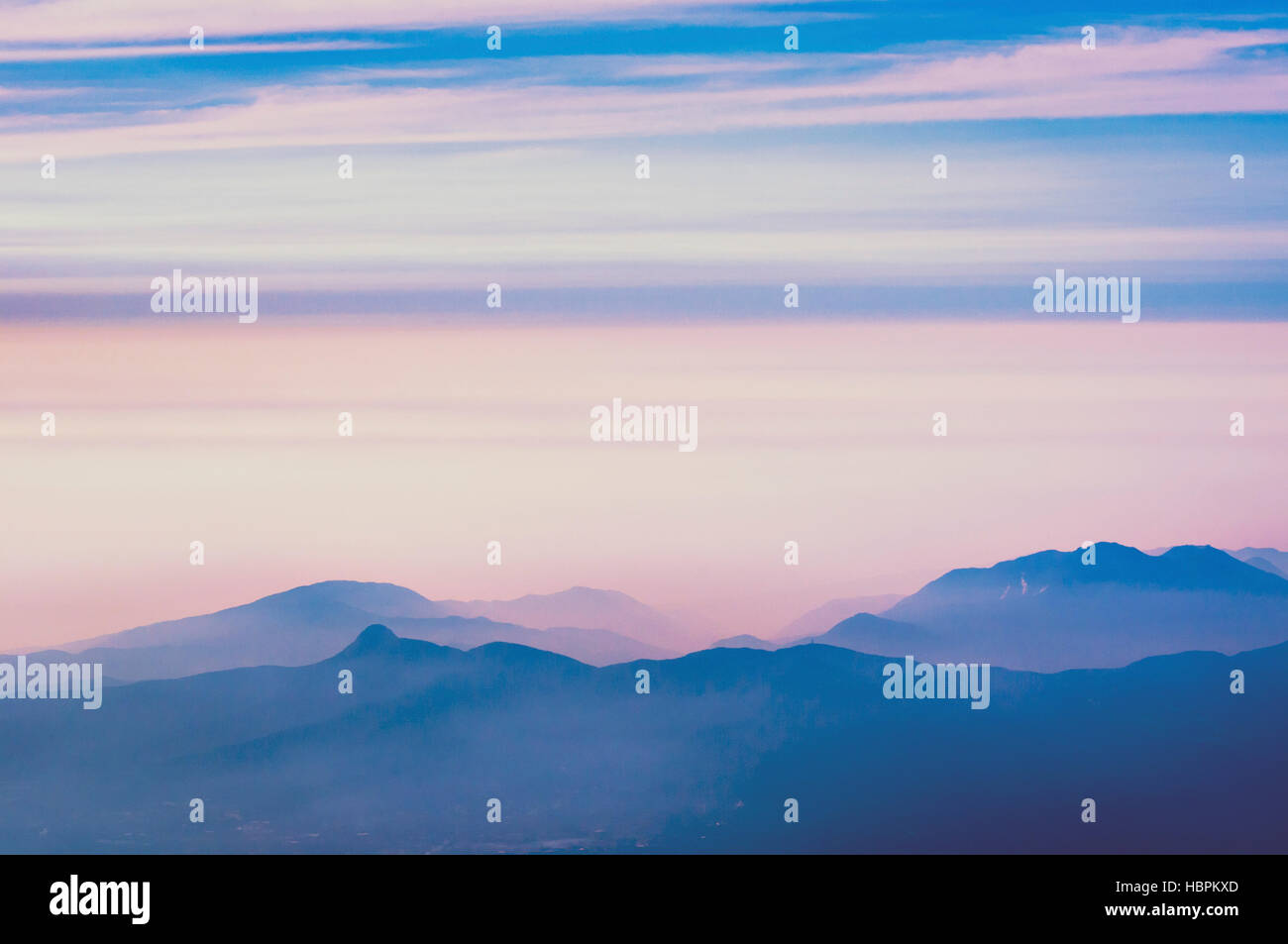 mountain ridges with scenic heat haze by early morning in Japan Stock Photo