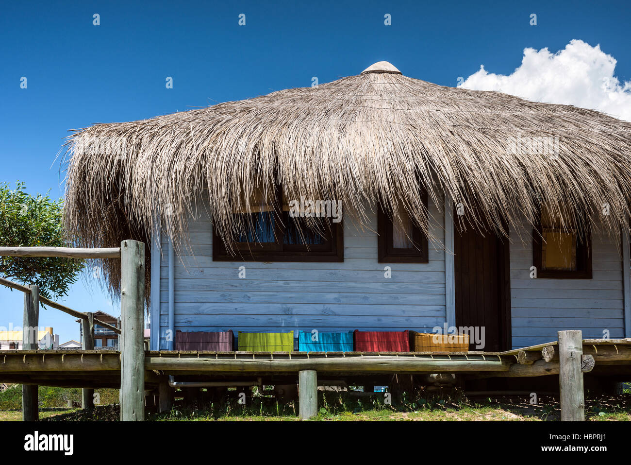 Typical brightly colored hous on the picturesque beach in Punta del Diablo, popular tourist place in Uruguay Stock Photo