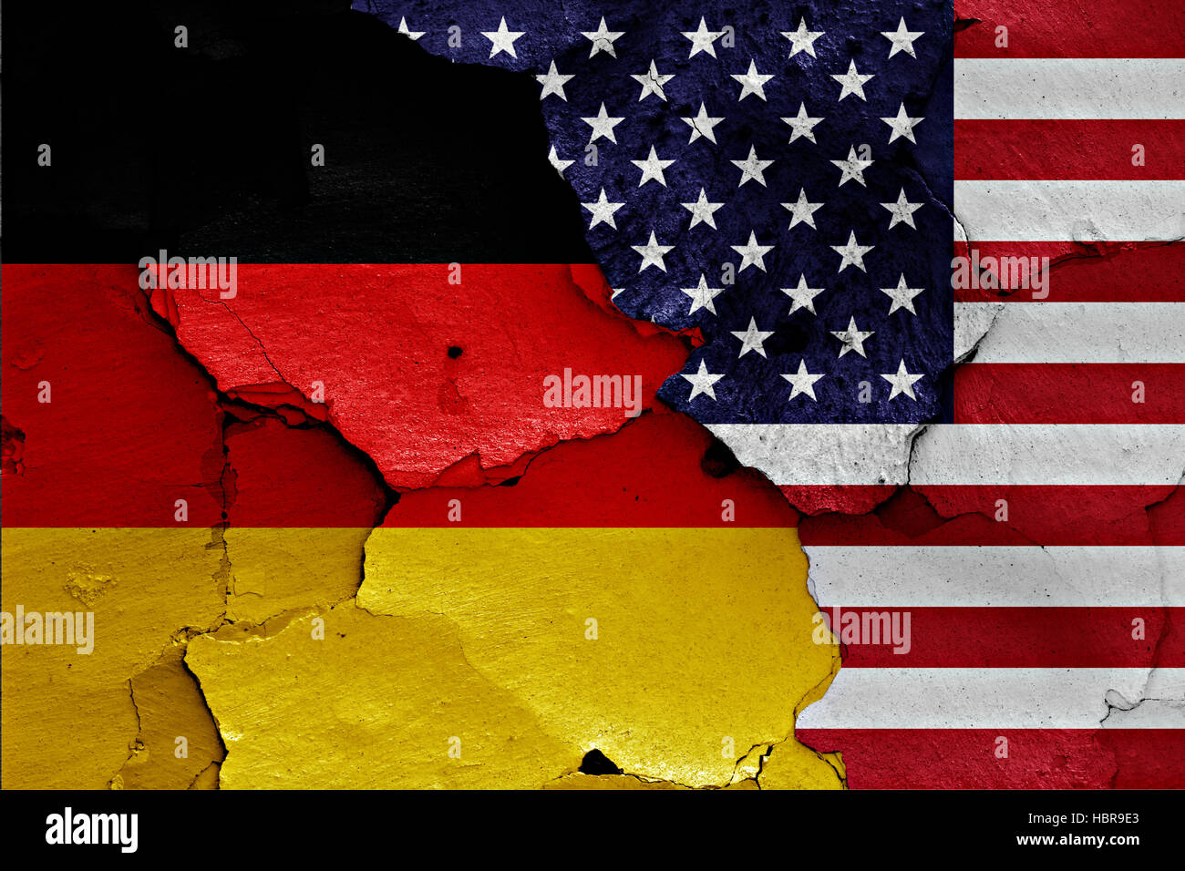 flags of Germany and USA painted on cracked wall Stock Photo
