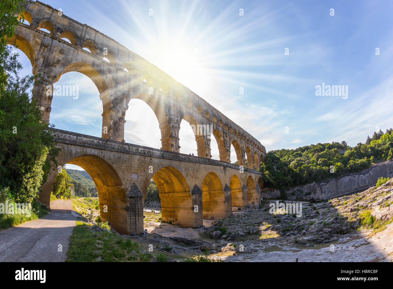 The setting sun shines in the sky Stock Photo